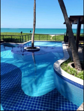 Apartamento beira mar em Guaxuma, pé na areia